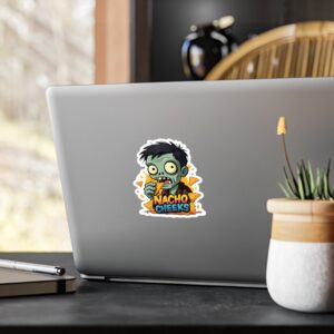 Zombie sticker on laptop with plant nearby.