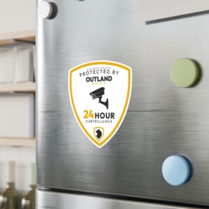 Outland Guard security sticker on a stainless fridge.